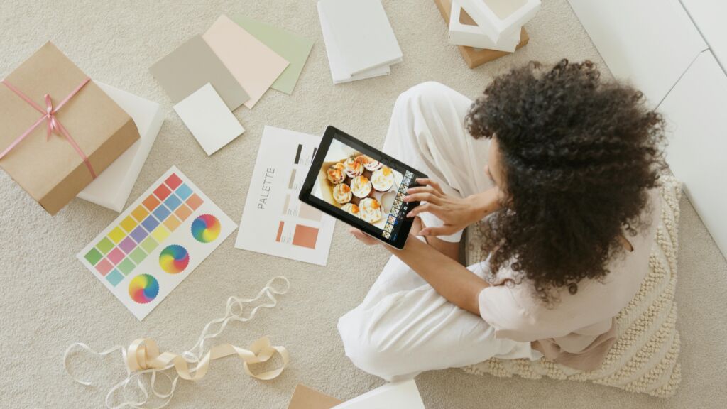 Smiling young woman launching her product, presenting it with confidence and creativity.