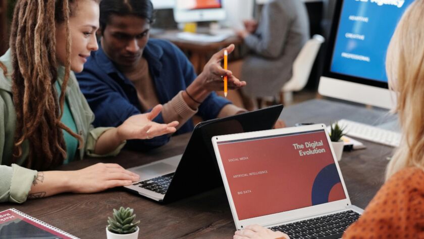 Creative agency team brainstorming ideas in a modern Lagos office, 2025