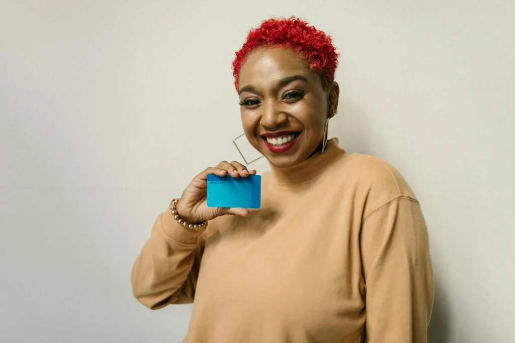 A lady holding a card